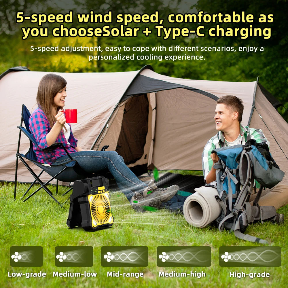 Two people camping with a portable cooling device, solar panel, and backpack.