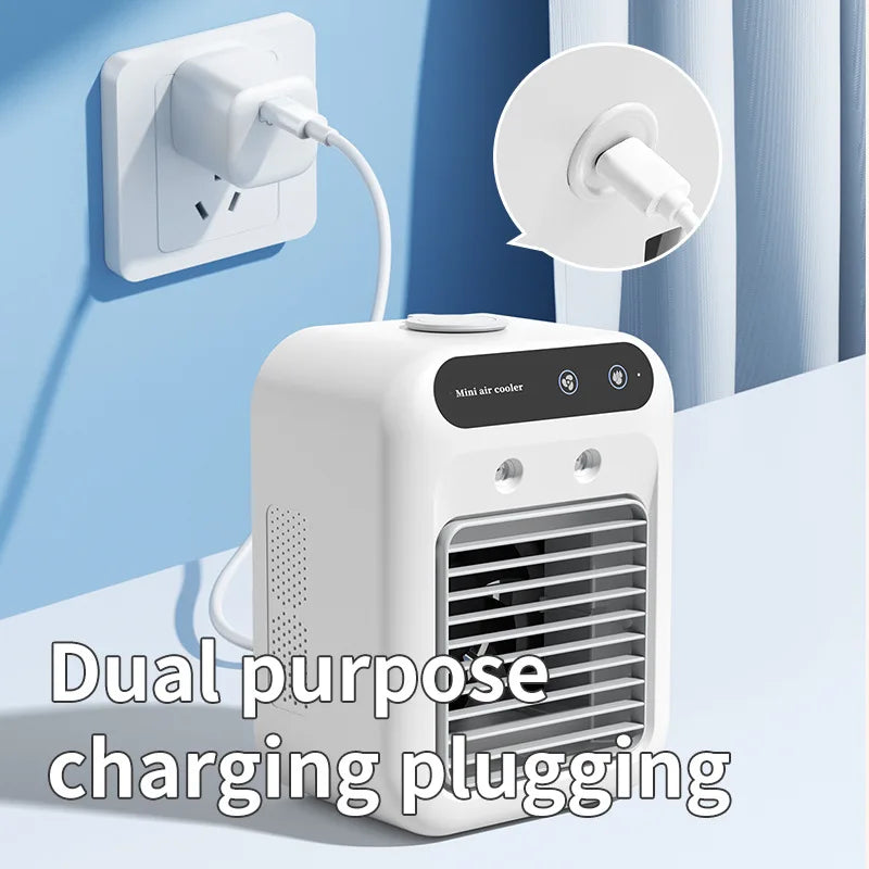 Portable fan charging via USB cable on desk