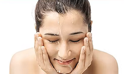 Woman cleansing skin before using cavitation body sculpting machine - preparing for treatment