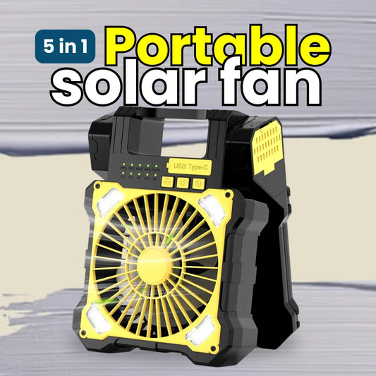 Portable solar fan with yellow blades and black casing on a gray background