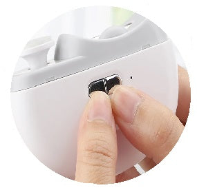 User presses power button on Electric Nail Clipper to activate device and select preferred speed for nail trimming.